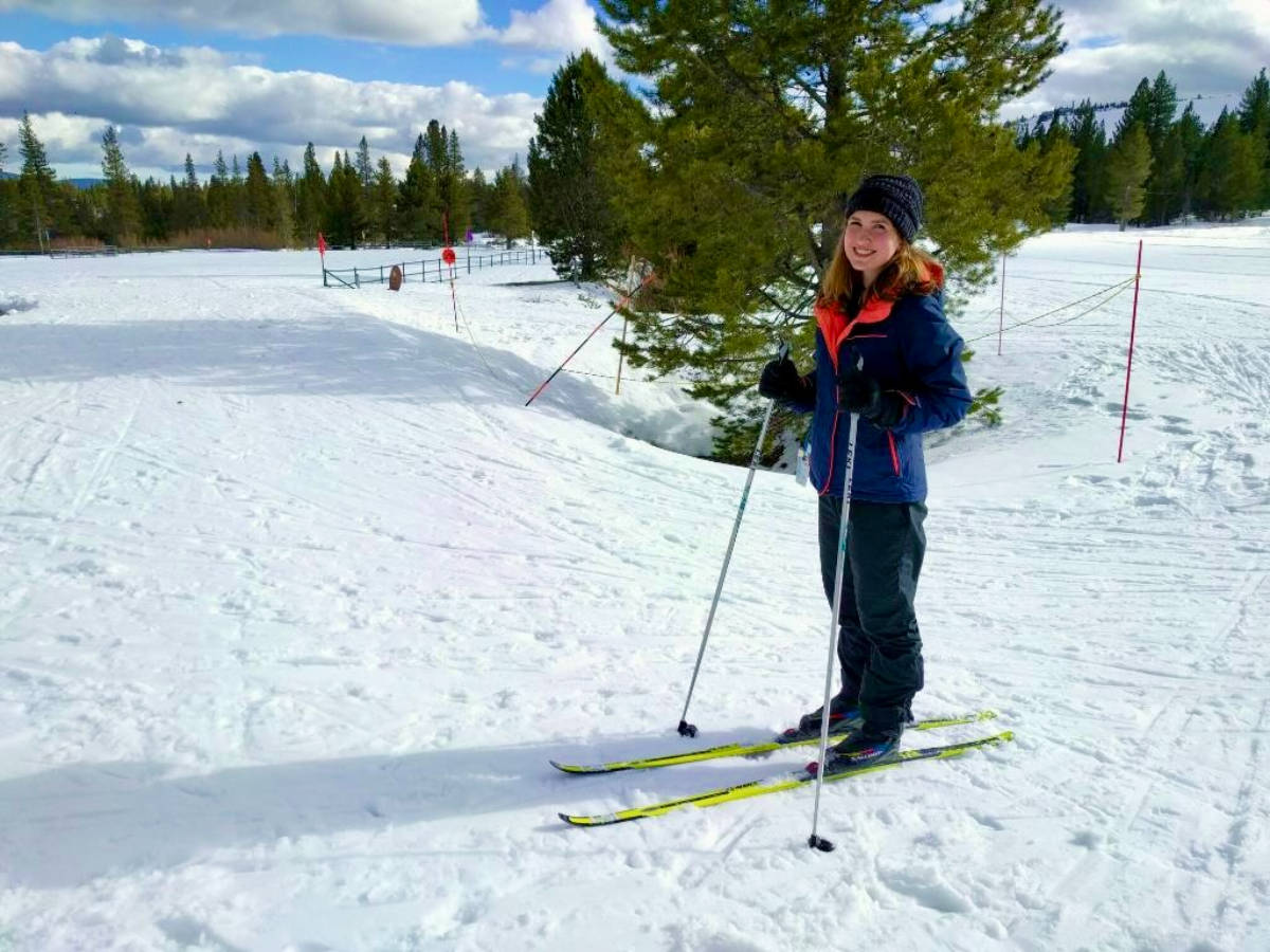 The author Laura McFarland, posing for a photo while cross-country skiing at Tahoe Donner Cross Country Ski Center