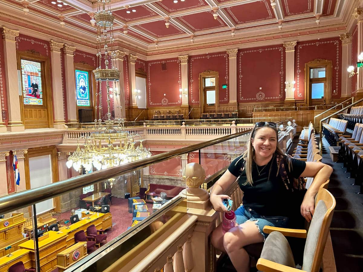 The author, Laura Falin smiling for a photo inside the Colorado State Capitol Building
