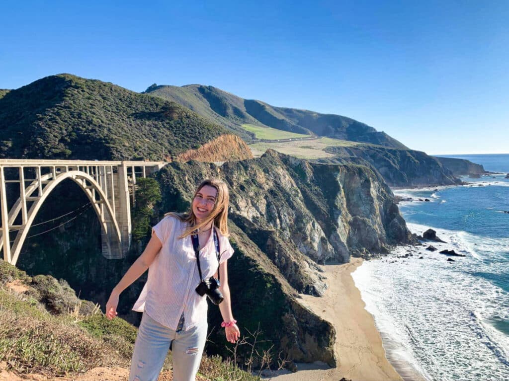 The author Laura McFarland, posing at the Bixby Creek Bridge