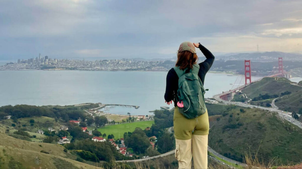 The author Laura overlooking the San Francisco skyline and Golden Gate Bridge