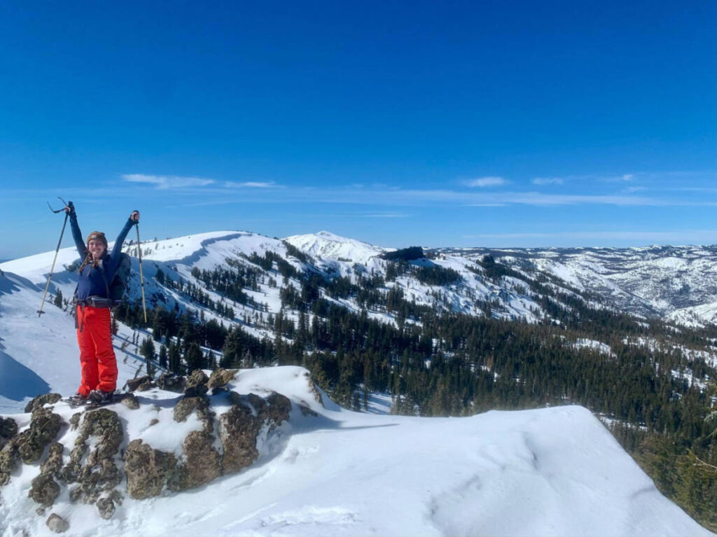The author Laura McFarland posing for a photo in the snow covered Sierra Nevada