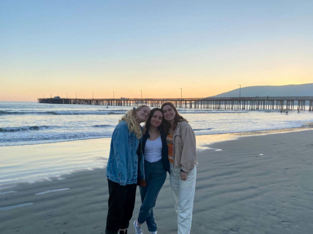 The author Laura McFarland and her friends at the Avila Beach at sunset