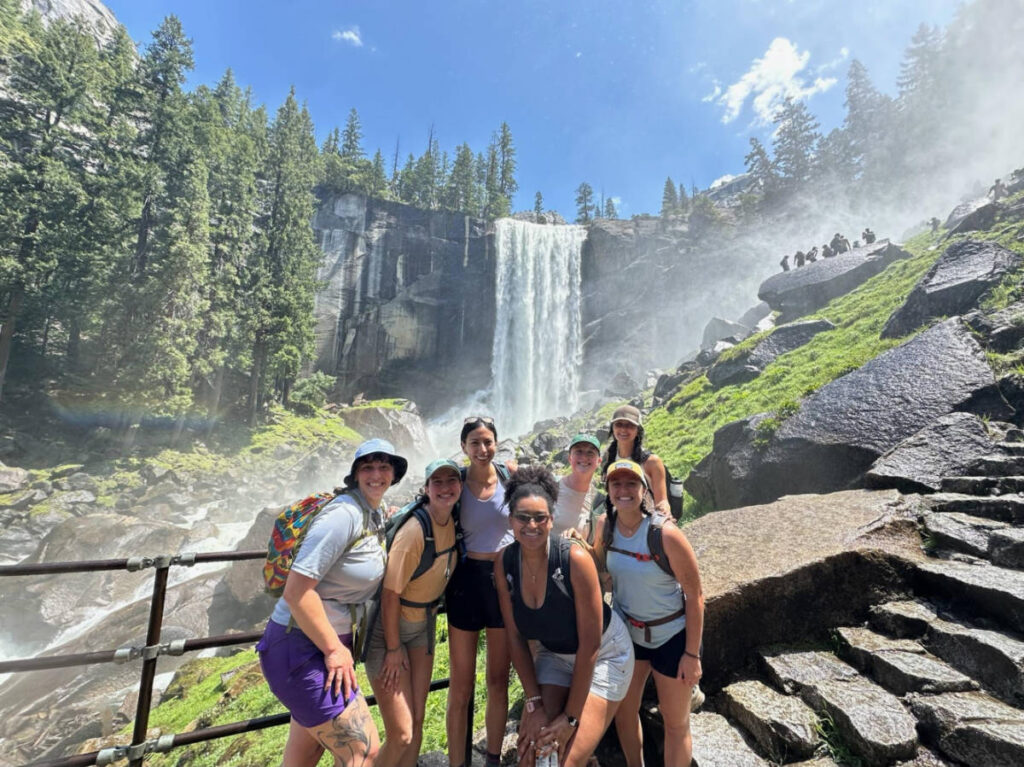The author Laura McFarland and her friends, smiling in front of the Vernal Falls