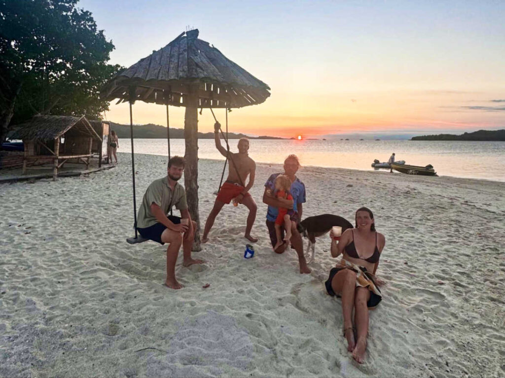 The author Laura McFarland and her crewmates enjoying the drinks on the Gili Kedis at sunset