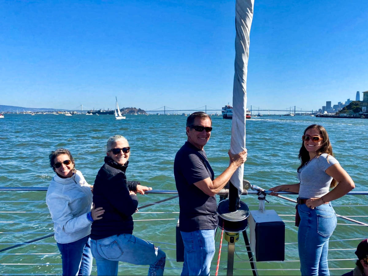 The author Laura McFarland and her friends, posing for a photo on their boat tour of San Francisco Bay