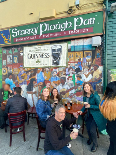 The author Laura McFarland with her family and friends drinking at the Starry Plough Pub