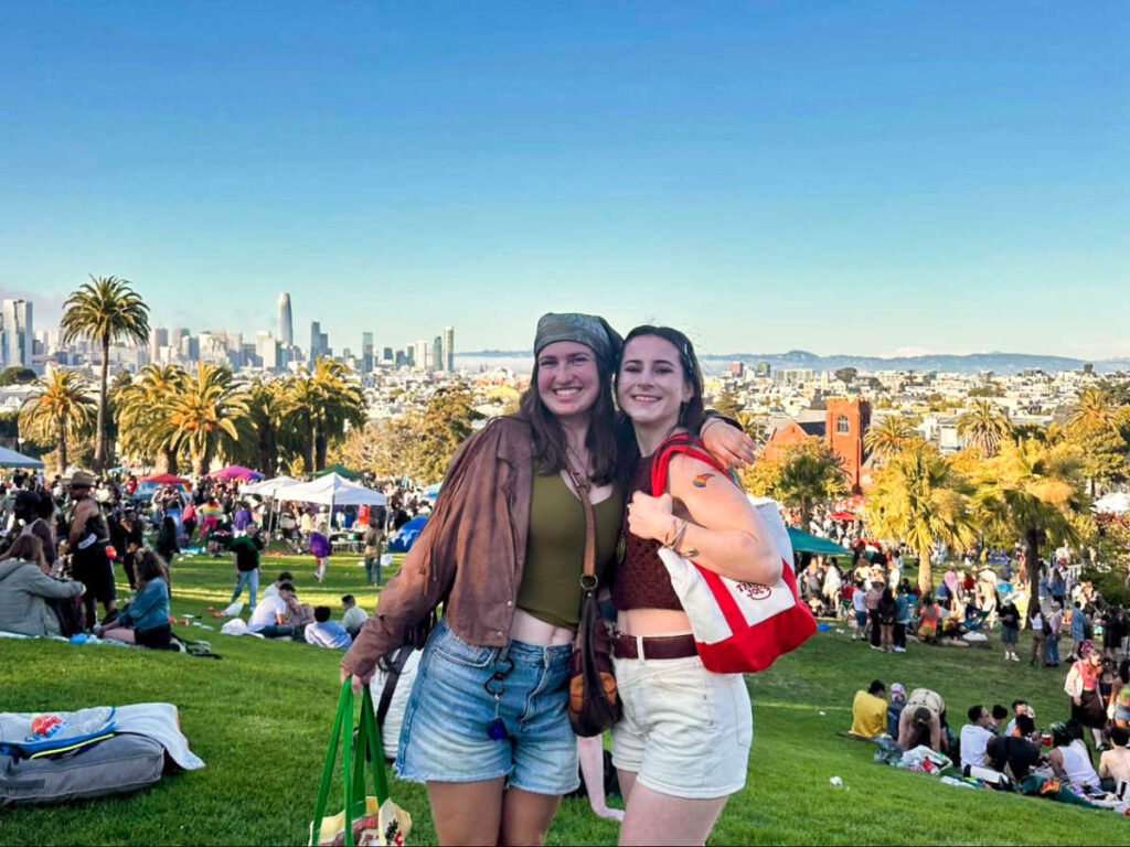 The author Laura McFarland and her friend posing for a photo at Mission Dolores Park