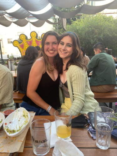 The author Laura McFarland and her friend  in the backyard beer garden
