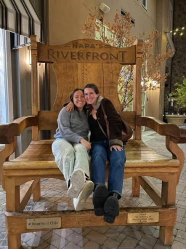 The author Laura McFarland and her partner sitting on a huge chair at the Napa Riverfront