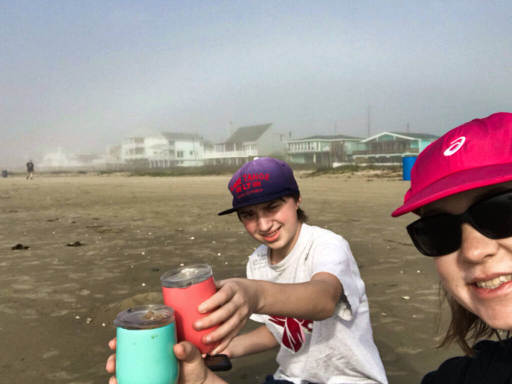 The author Laura Falin and her son having coffee along the shoreline