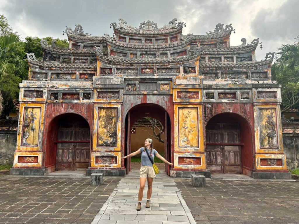 The author Laura McFarland posing in front of a gate in the old imperial Palace