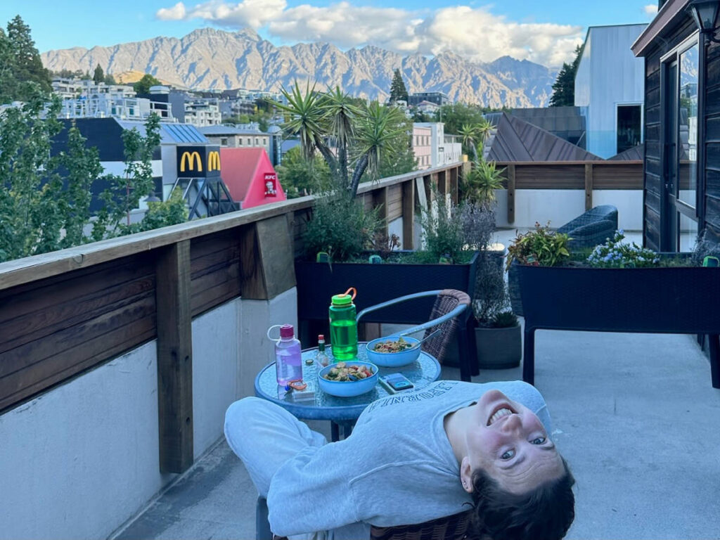 The author, Laura McFarland enjoying her breakfast on a balcony