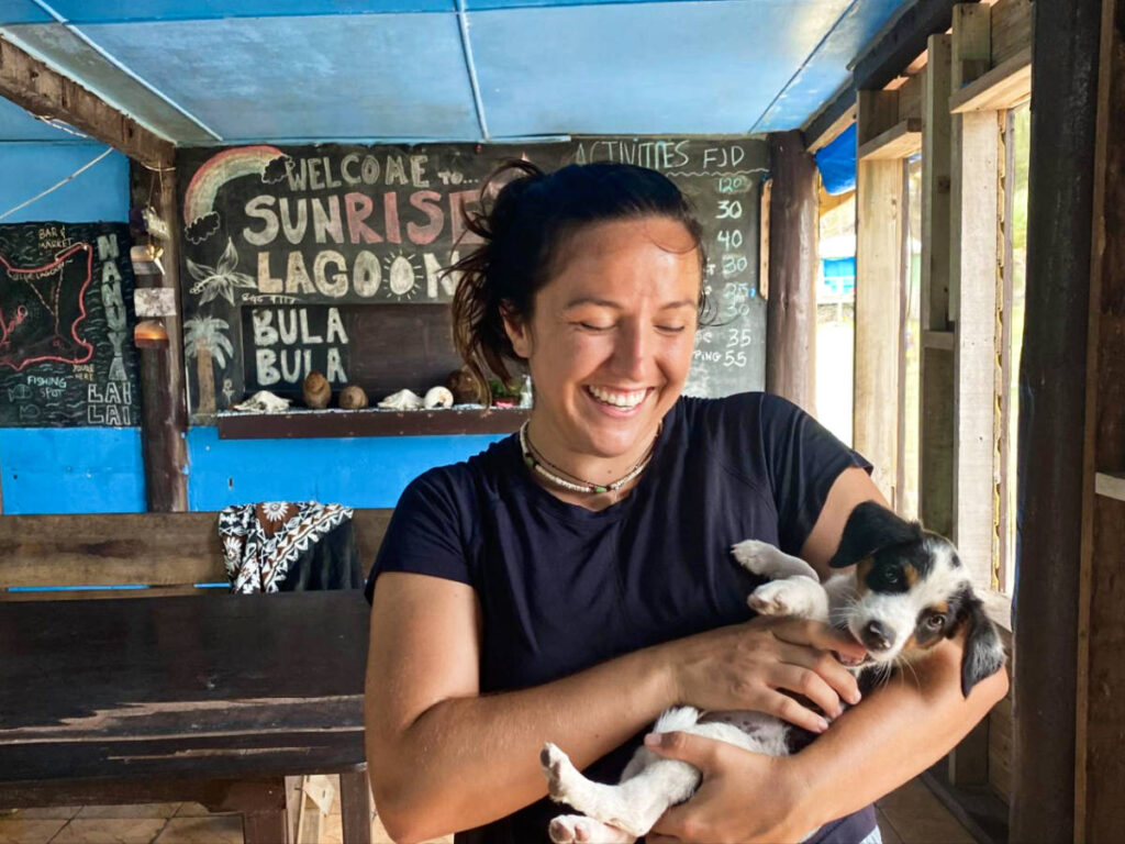 The author's partner playing with a dog 