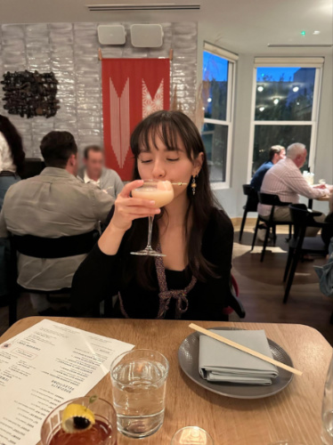 The author Lea Rose Allbaugh, drinking lychee martini at Itoko