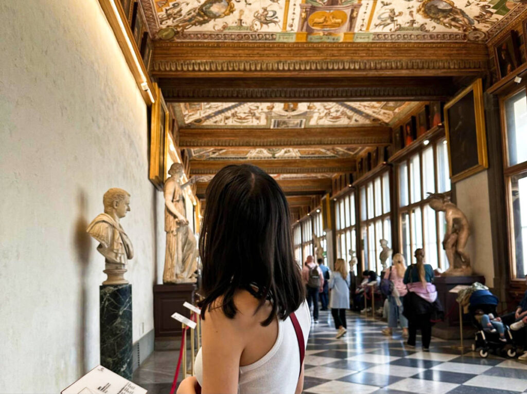 The author Lea Rose Allbaugh, gazing up at the frescoed ceilings