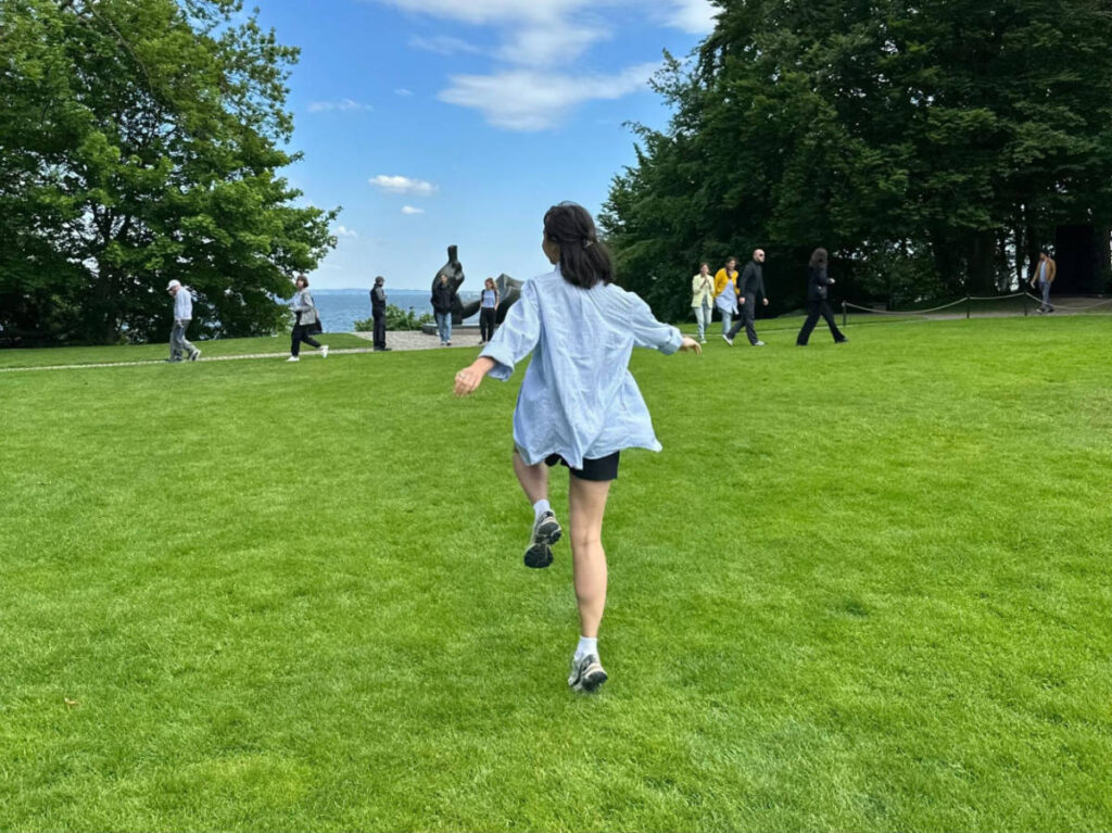 The author Lea Rose Allbaugh, enjoying the vast green field