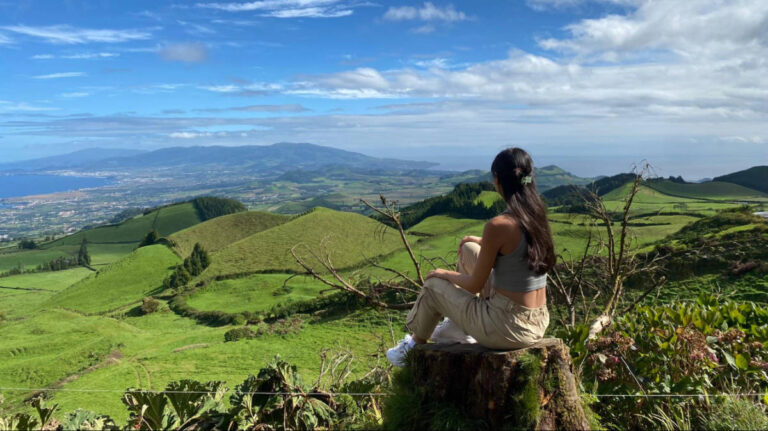 The author Lea Rose Allbaugh admiring the overlooking view in Sao Miguel Island