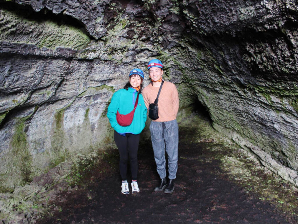 The author Lea Rose Allbaugh and her friend inside the lava flow cave