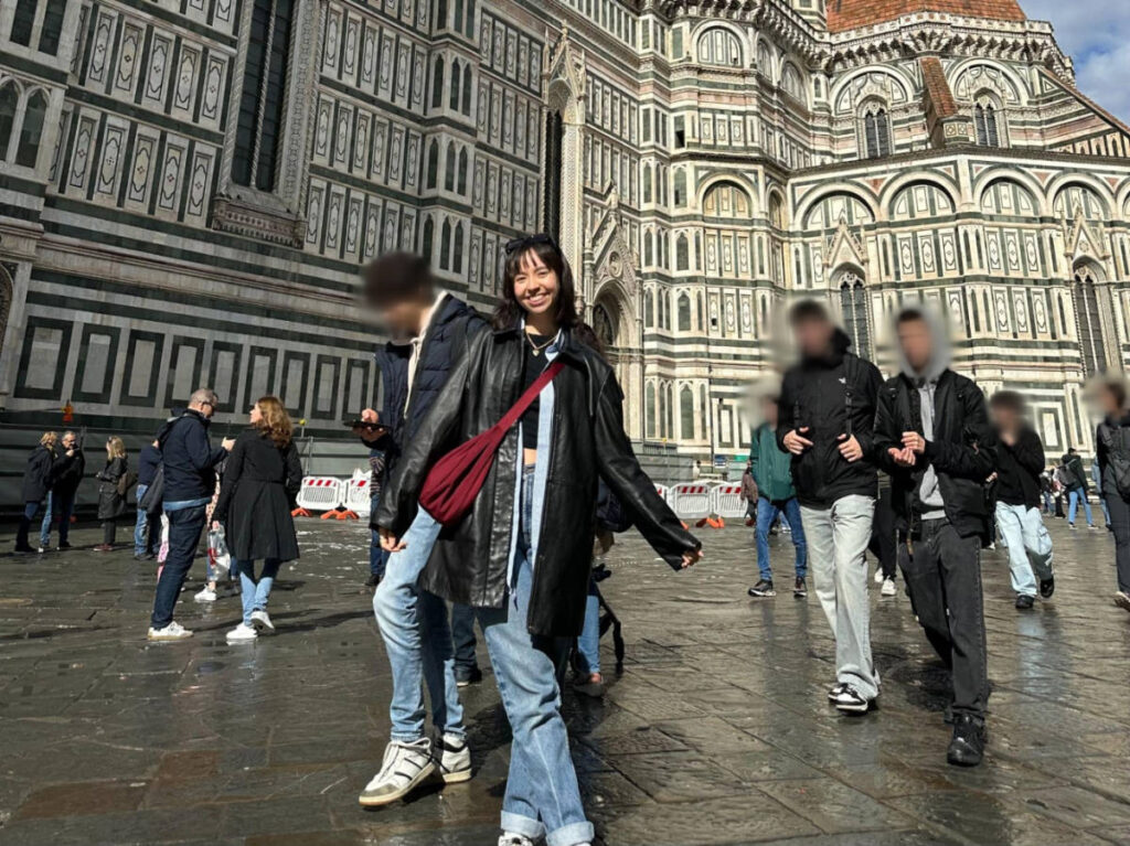 The author Lea Rose Allbaugh, posing for a in front of the Florence Cathedral