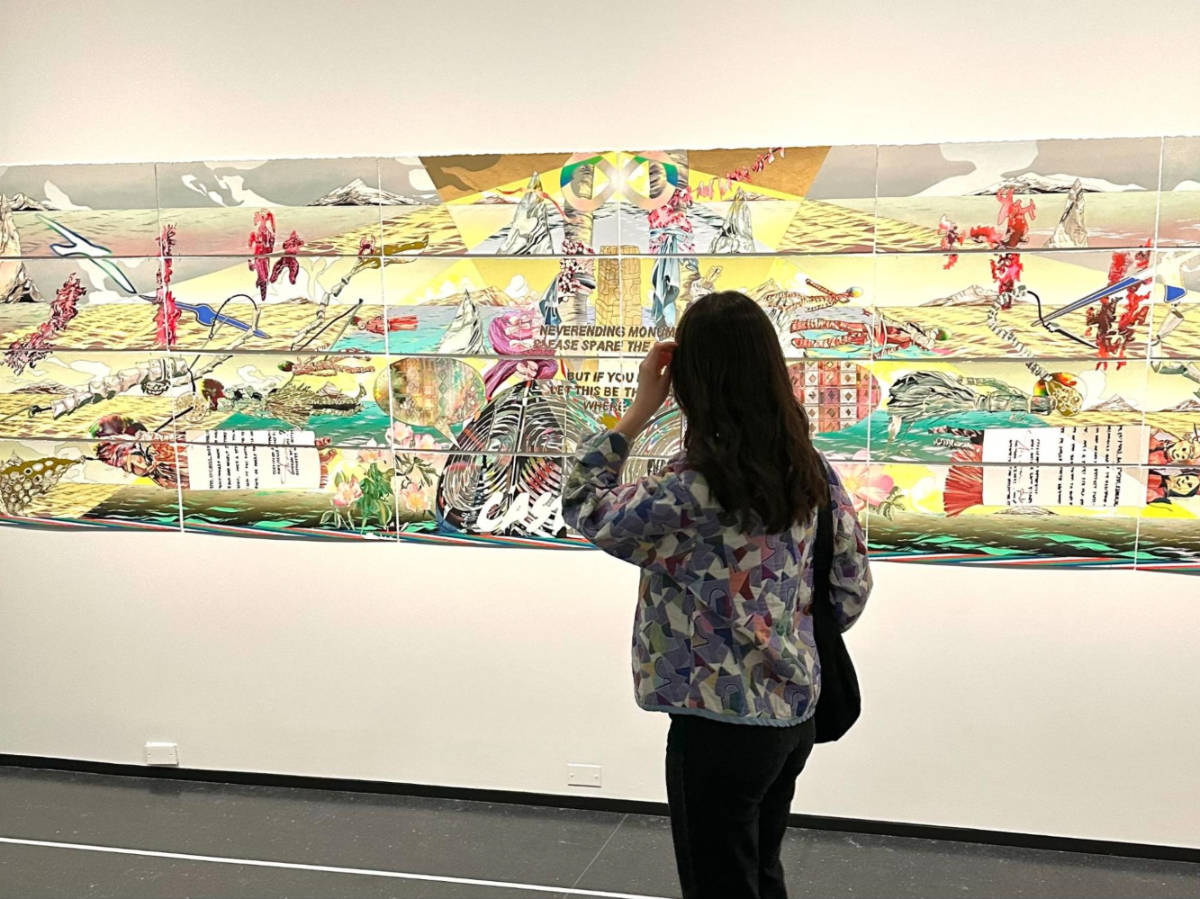 The author Lea Rose Allbaugh, looking at the art displays in the  Museum of Contemporary Art