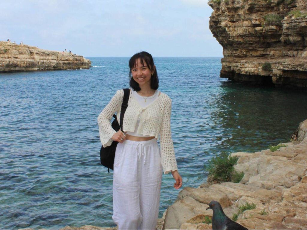 The author Lea Rose Allbaugh, posing for a photo in Polignano a Mare