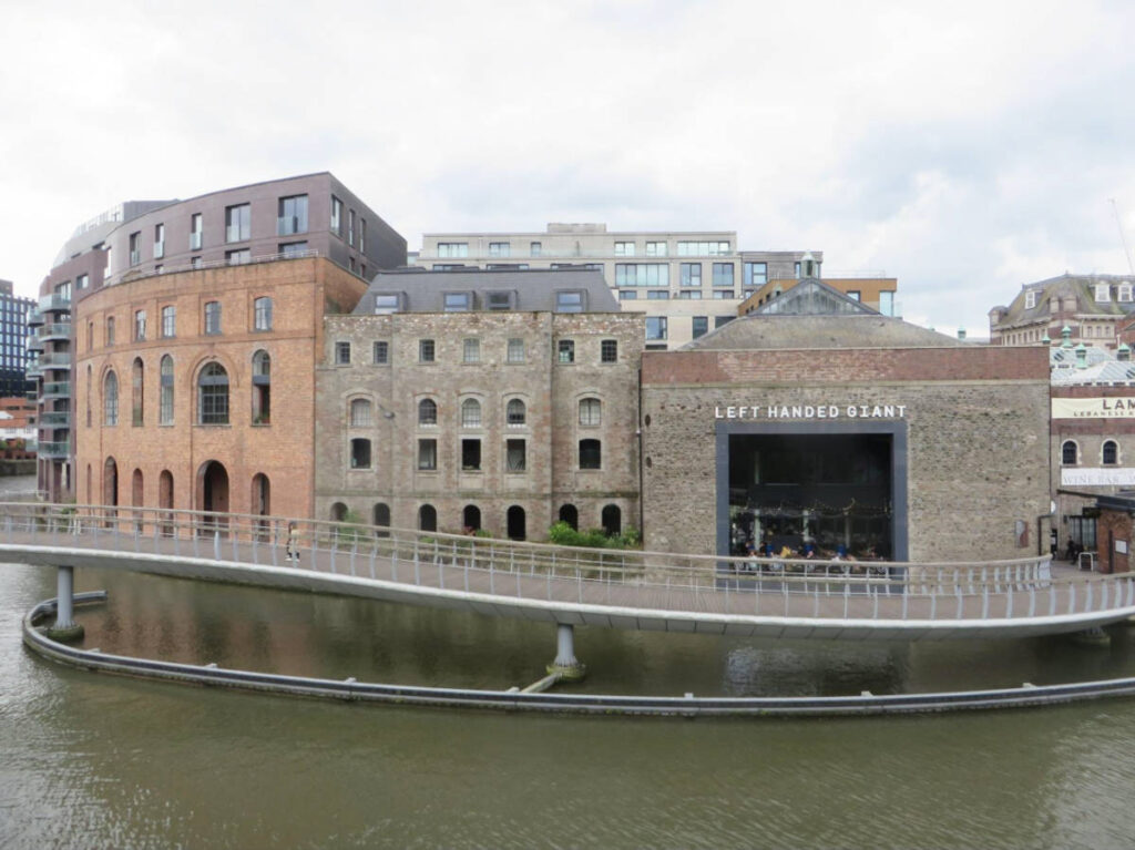 View of the building of Left Handed Giant Brewpub from across the water