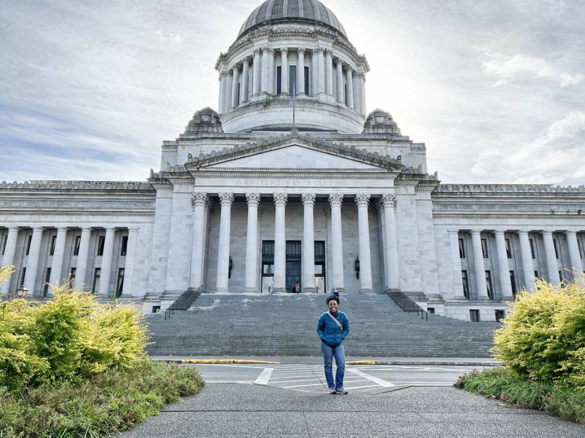The author Chelsea Booker in front of the Legislative Building on Capitol Campus