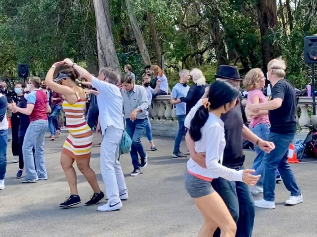 Couples enjoying their day, dancing in Lindy in the Park