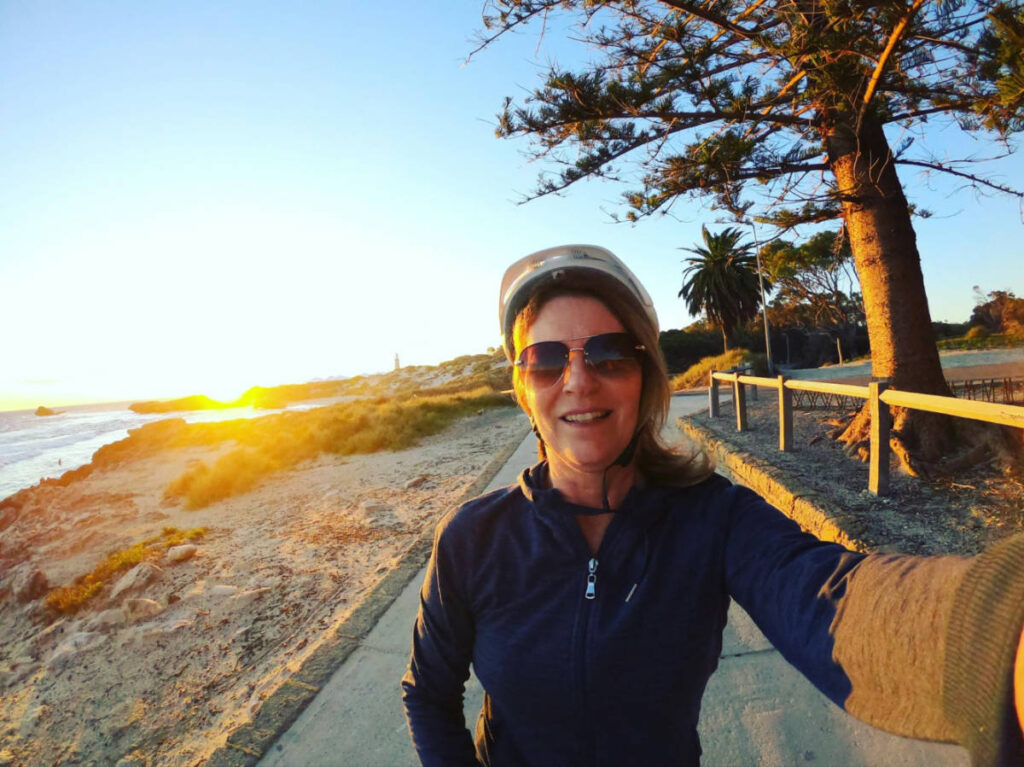 The author Lisa Ikin, enjoying the sunset views on Rottnest Island while on her bicycle