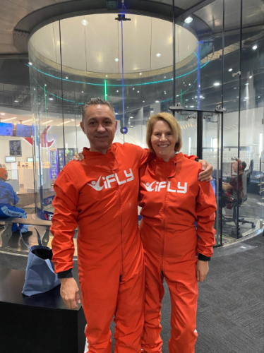The author Lisa Ikin and her partner, posing for a photo in iFly