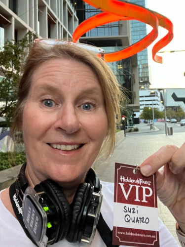 The author Lisa Ikin, showing her VIP card on the Hidden Detours Tour
