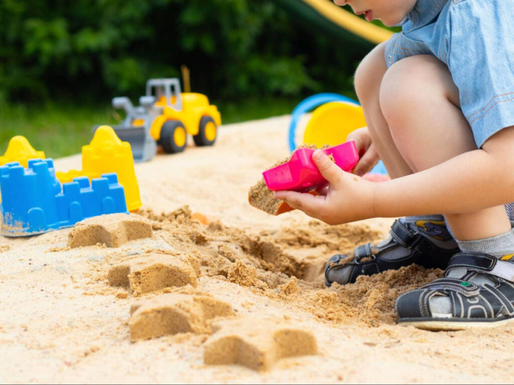 A child playing on the sand