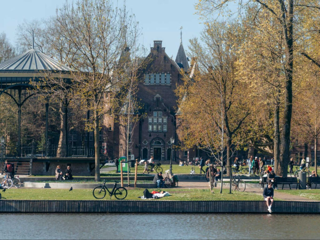 People relaxing near the river in Oosterpark