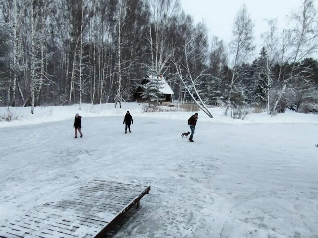 People ice skating on a frozen lake in Tartu
