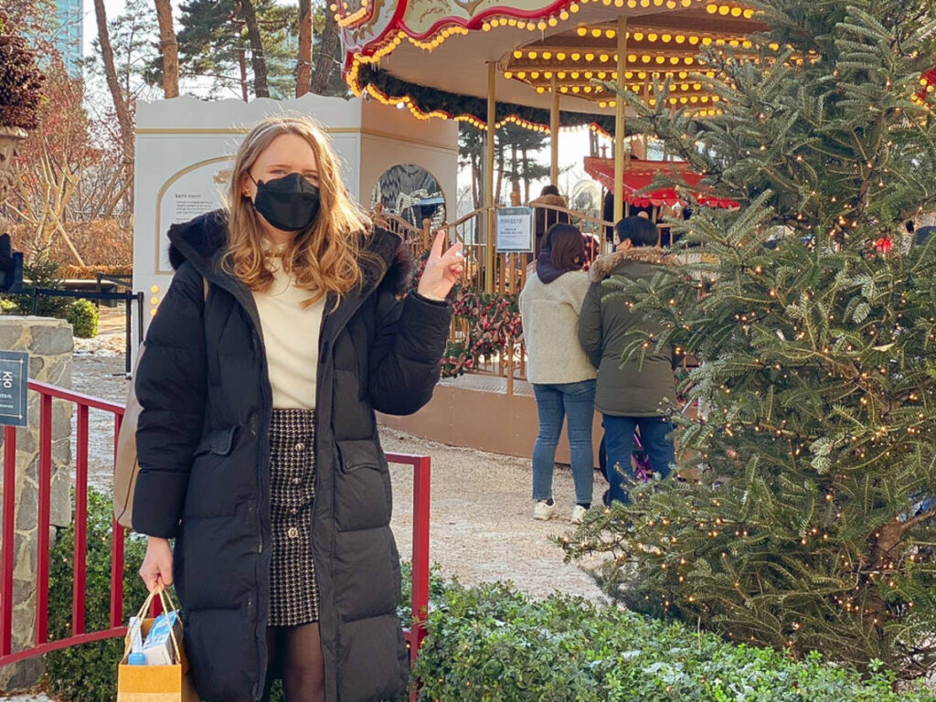 The author, Bethan Nutting posing for a photo at the Lotte Tower Christmas Market