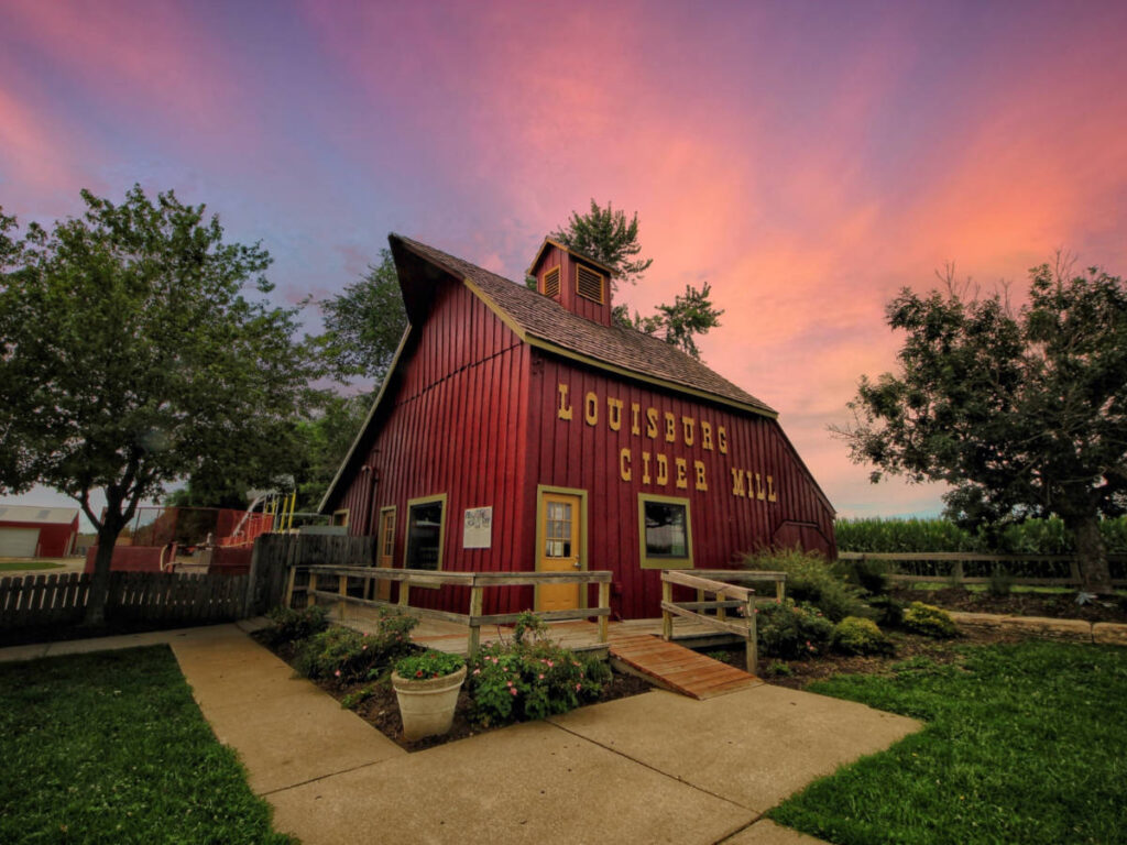 View of the beautiful sunset behind the Louisburg Cider Mill