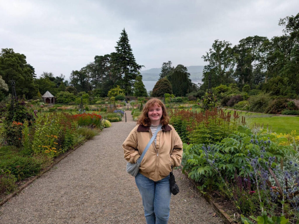 The author Louise Wylie, standing on the pathway of Brodick Castle grounds