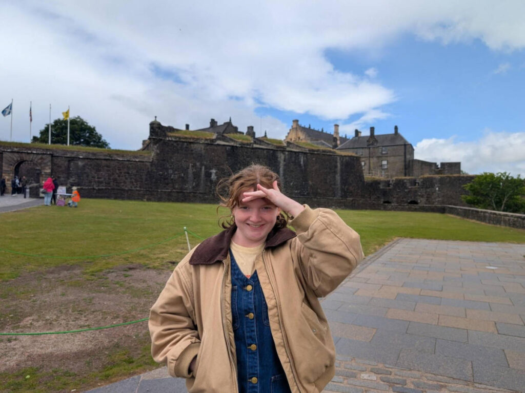 The author Louise Wylie standing in front of the Stirling Castle