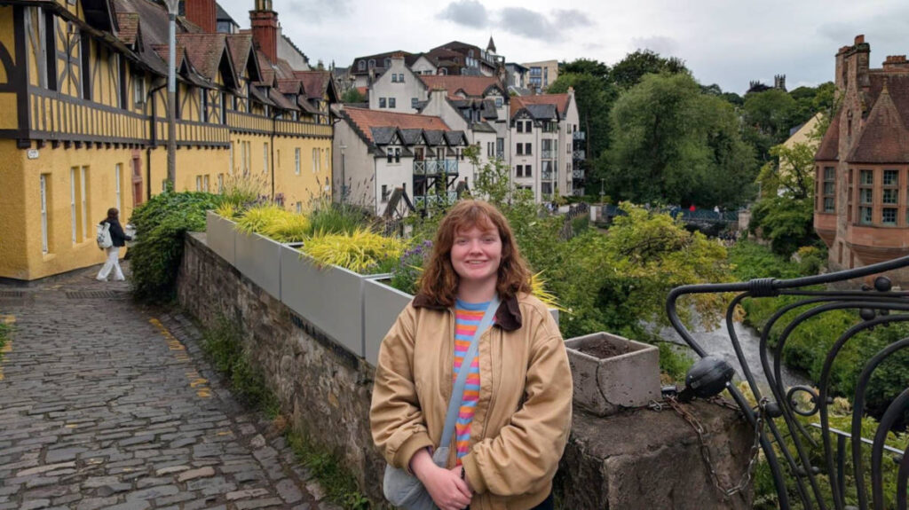 The author Louise Wylie smiling for a photo at the Dean Village