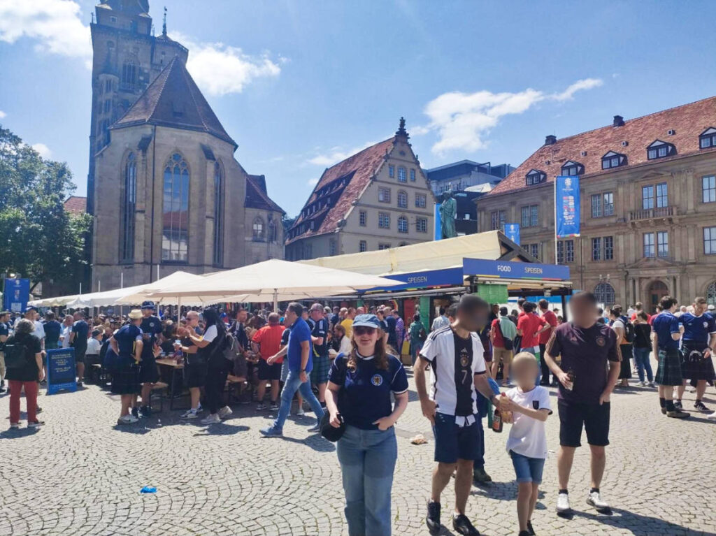 The author Louise Wylie posing for a photo at the food market in Stuttgart