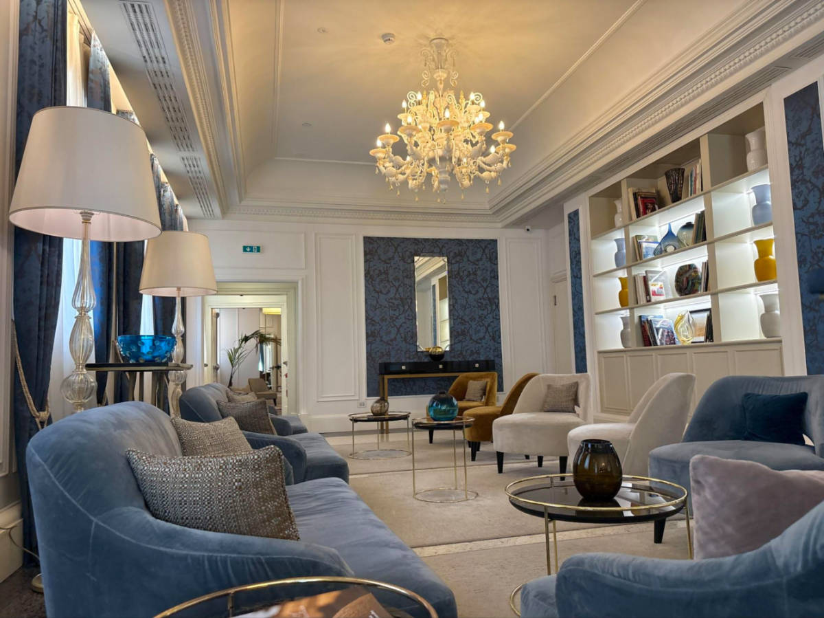 View of the modern interior of the lounge area of H10 Palazzo Canova
