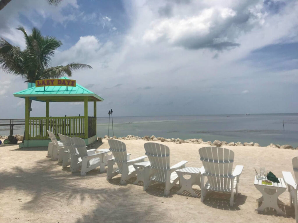 View of the beach loungers along the shoreline at Lazy Days