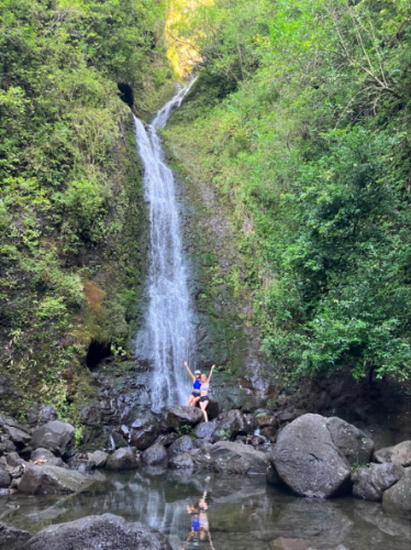 The author Rebecca Parsons and her friend beneath the Lulumahu Falls