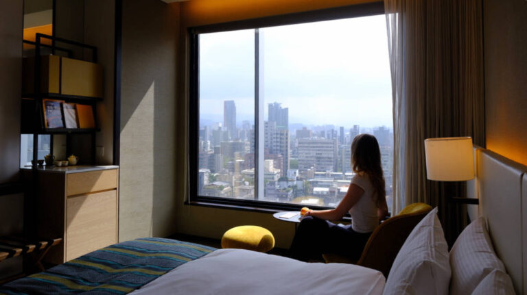 The author, Sky Ariella admiring the view from her room in MGH Mitsui Garden Hotel