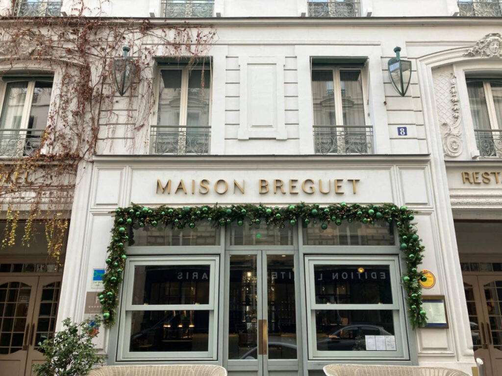 The facade of Maison Bréguet hotel with Christmas decorations