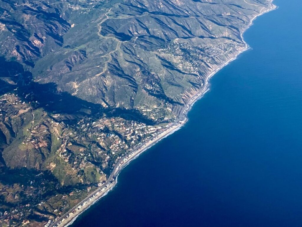 Malibu Beach seen from inside the airplane flying above