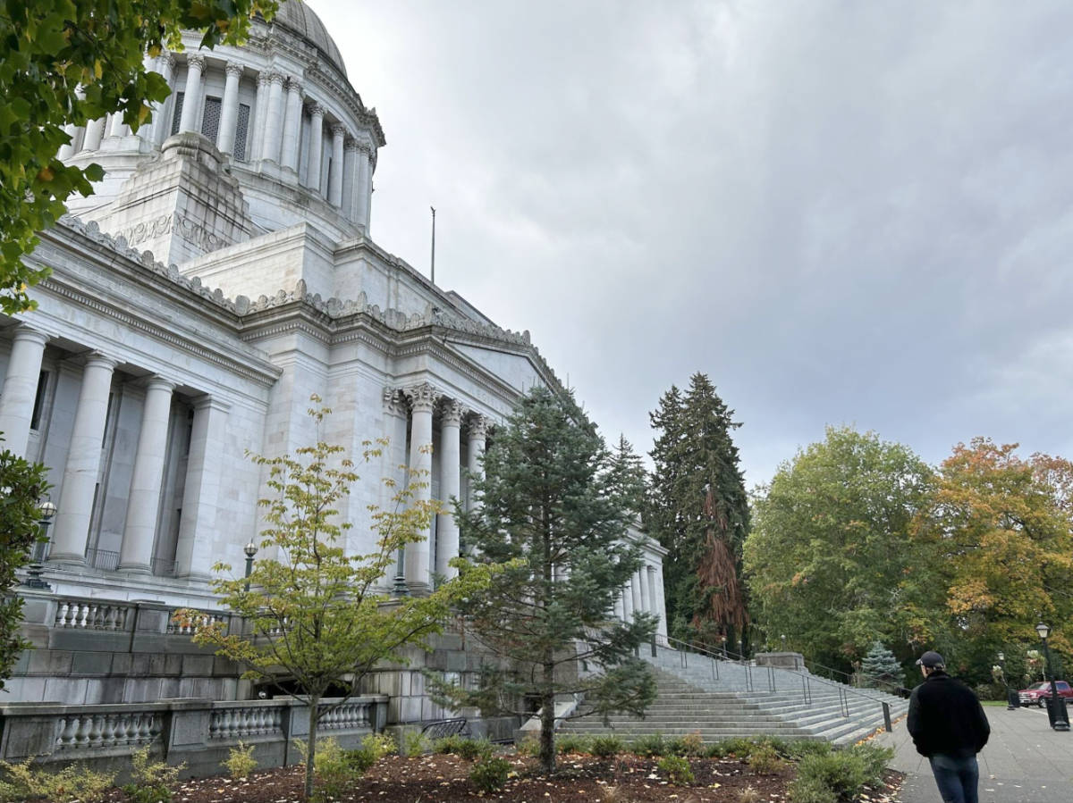 The author's husband walking outside the Capitol Campus in fall