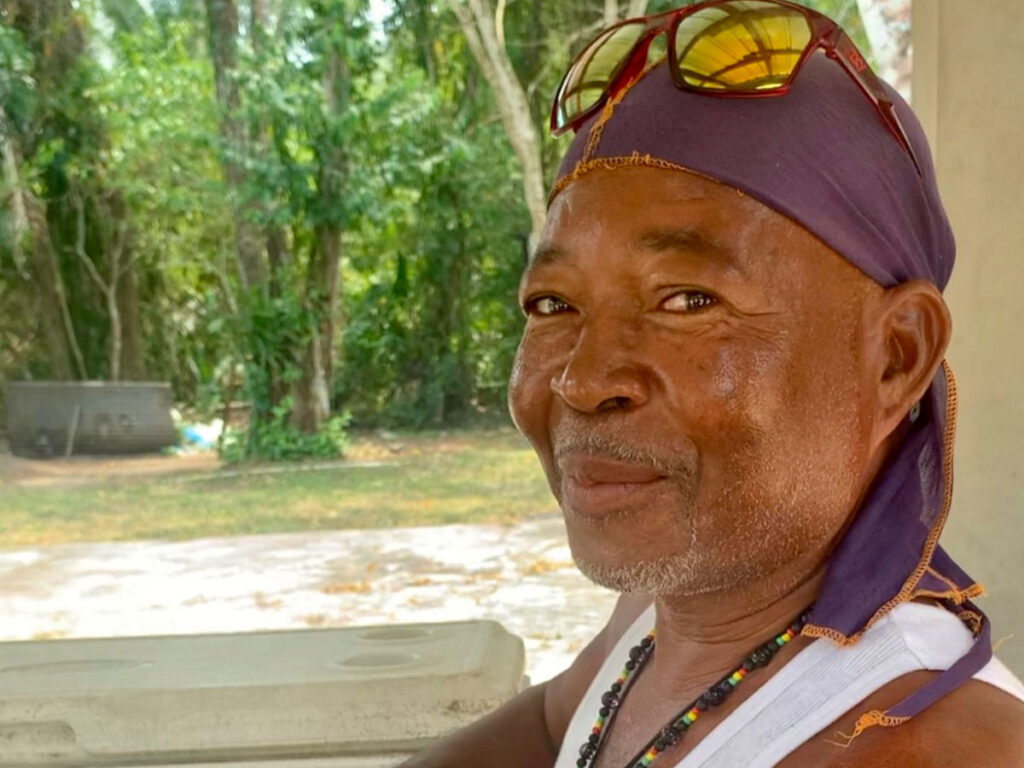 Man smiling for a photo in Caye Caulker