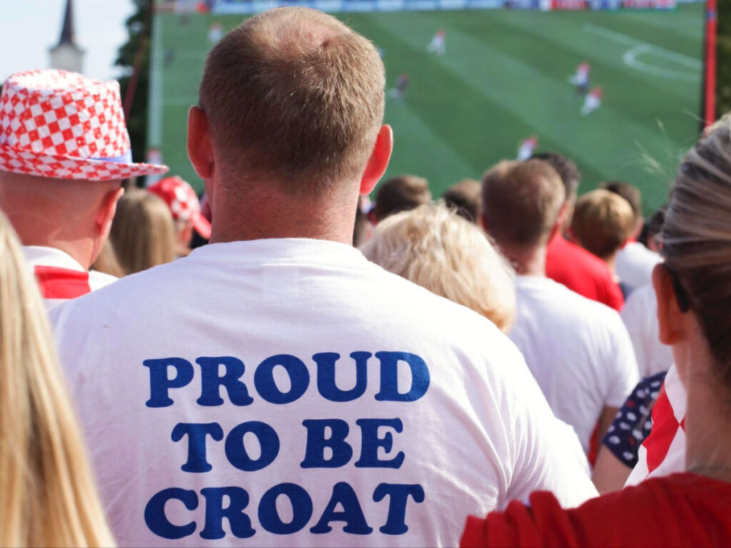 A man wearing Proud to be Croat shirt at a World Cup Final watch party
