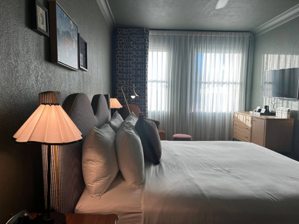 View of a bed at the MarQueen Hotel